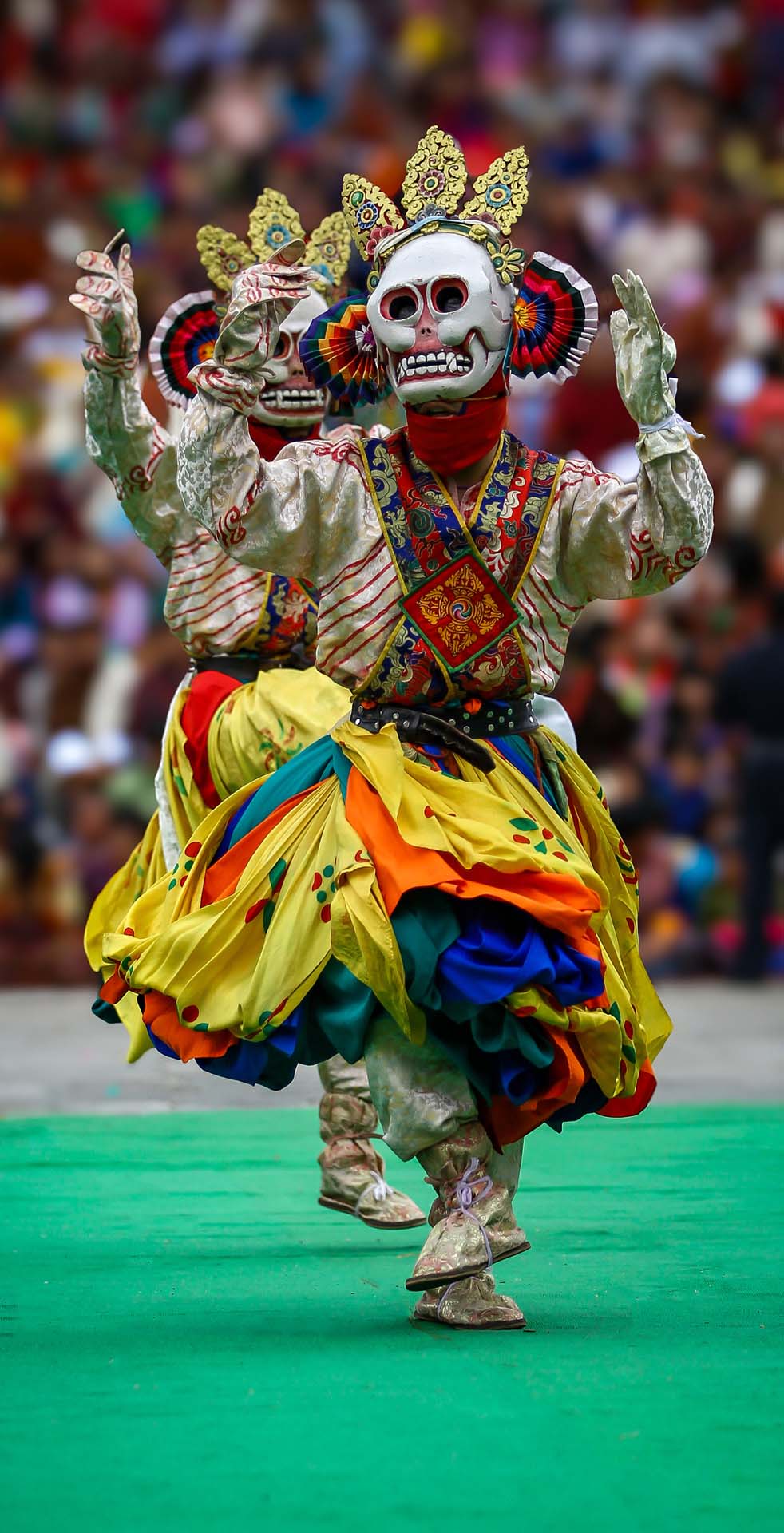 Dancers performing at a Bhutanese tsechu festival